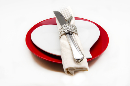 Dish with napkin and cutlery on white backgroundの写真素材