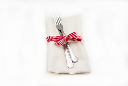 Napkin and cutlery on white backgroundの写真素材