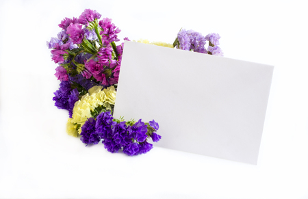 Flowers with greeting card on white backgroundの写真素材