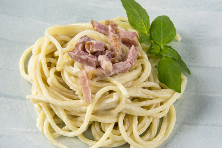 Spaghetti with carbonara sauce and baconの写真素材