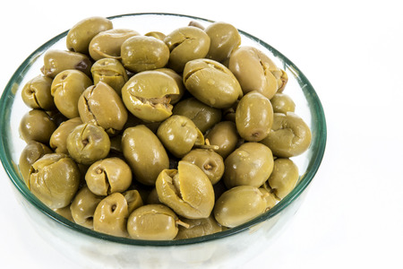 Green olives served in a bowlの写真素材