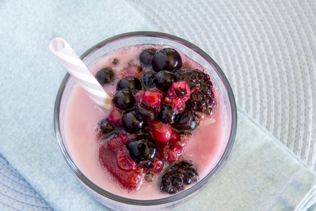 Strawberry milkshake with red berriesの写真素材
