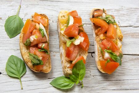 Bruscheta, antipasti Typical Italian with tomato, basil and toastの写真素材
