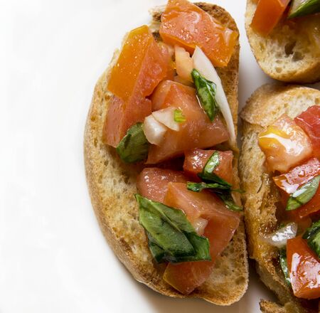 Bruscheta, antipasti Typical Italian with tomato, basil and toastの写真素材