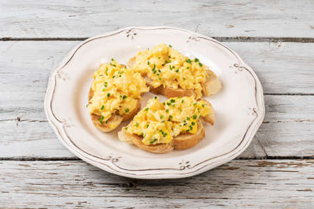 Scrambled eggs served on a plateの写真素材