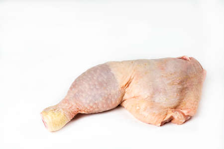 Raw chicken thigh on white backgroundの写真素材