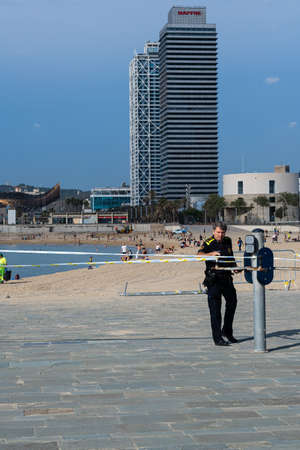 BARCELONA, SPAIN - MAY 25th 2020: First day of the phase 1 of the coronavirus disease (COVID-19) in Barcelona, police closing down a common exercise area for elderly peopleのeditorial素材