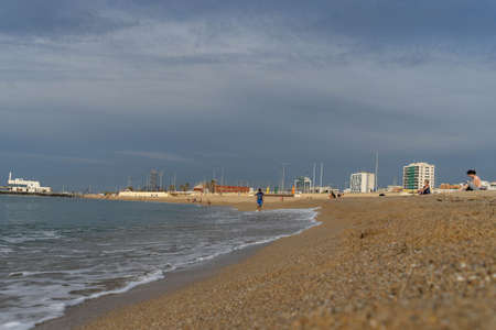 BARCELONA; SPAIN - MAY 25th 2020: First day of the phase 1 of the coronavirus disease (COVID-19) in Barcelona, people taking advantage of the hours allowed to swim in the Poblenou beachのeditorial素材