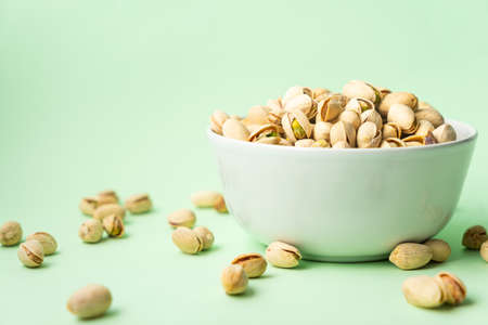 toasted pistachios in a bowl. Nuts vegan proteinの写真素材