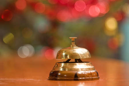 old hotel bell on a wood stand at Christmasの写真素材