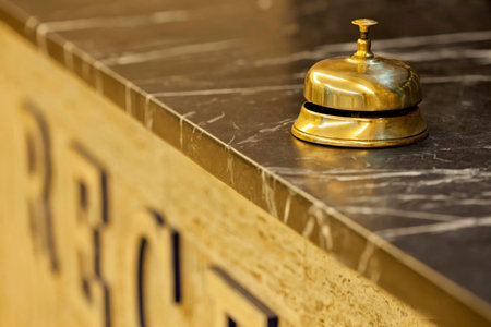 old hotel bell on a marble standの写真素材