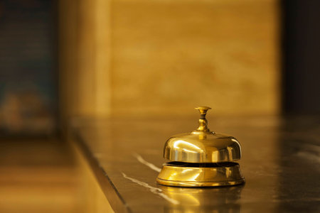 old hotel bell on a marble standの写真素材