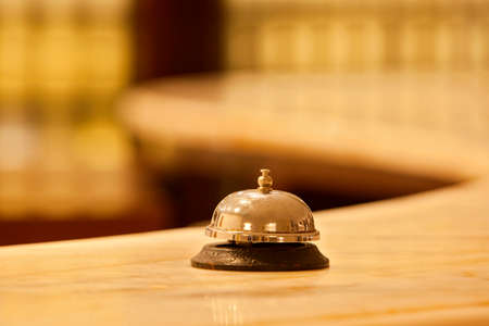 old hotel bell on a marble standの写真素材