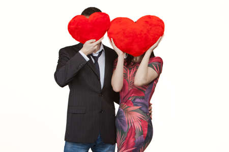 one couple in love with two red hearts in Valentine's Dayの写真素材