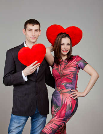 one couple in love with two red hearts in Valentine's Dayの写真素材