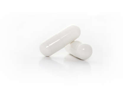Closeup white medicine capsules
