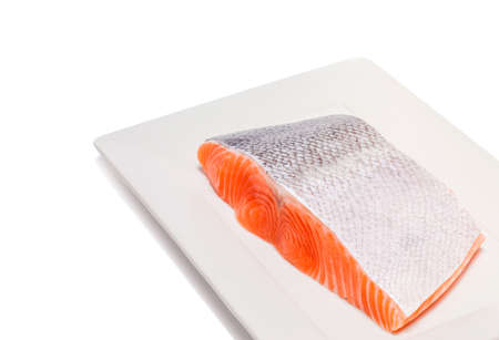 salmon fish fresh meat slice isolated on white backgroundの写真素材