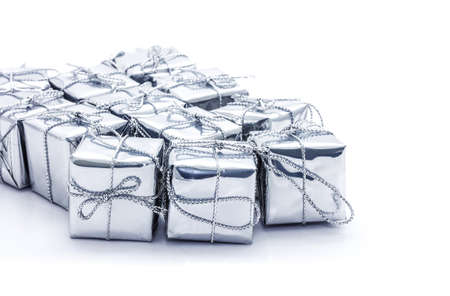 Silver christmas gift boxes isolated on white backgroundの写真素材