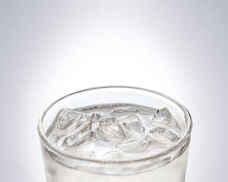 glass of cool freshness water with ice, ready for drinkの写真素材