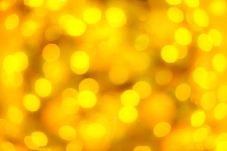 golden blurry bokeh celebrate background for decorationの写真素材