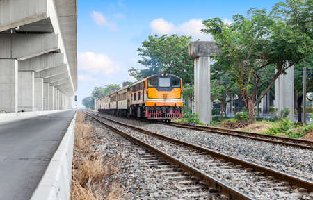 trains in bangkok thailand running on the railway with low speed