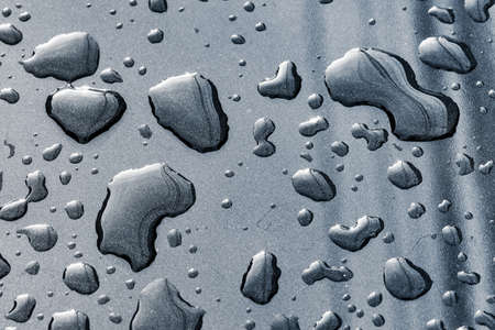 texture of raindrops on a car surface after raining, raining seasonの写真素材