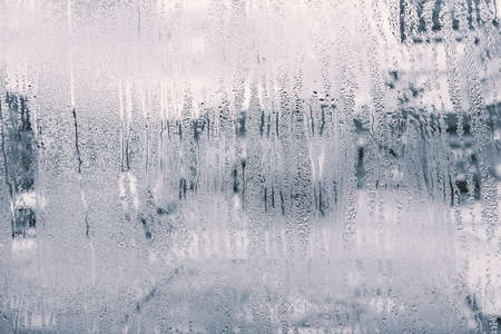 raindrops on glass window in rainy season with monotoneの写真素材