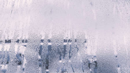 raindrops on glass window in rainy season with monotoneの写真素材