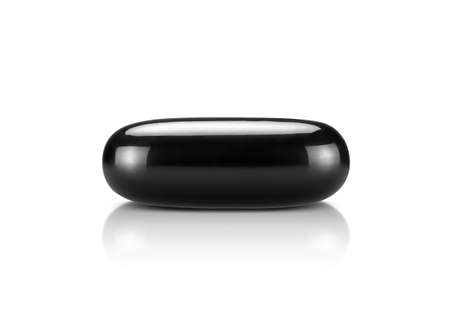 black supplement capsule isolated on white background with clipping pathの写真素材