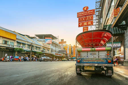 CHINA TOWN, BANGKOK THAILAND - 12 MAY 2018: Sunset at Yaowarat road with Tuk Tuk Taxi, The main street of China Town in Bangkok , Yaowarat is one of the famous landmark of Chinese Arts and Buildings in Bangkok, Thailand.のeditorial素材