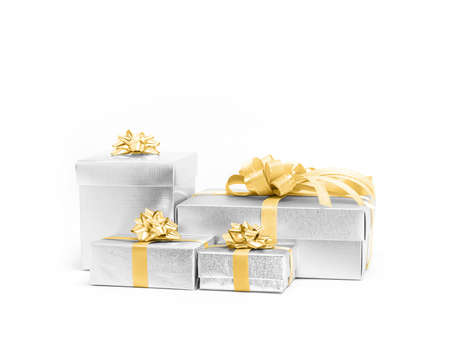 Celebration silver gift boxes with gold ribbon flower bow for decoration isolated on white...