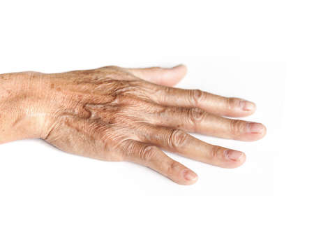 wrinkle hand of old woman isolated on white backgroundの写真素材