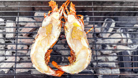 lobster grilled on hot charcoal grill this is delicious local asia food on market street of yaowarat...