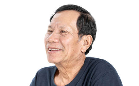 old wrinkled asian man portrait with good mood and wear navy blue T-shirt isolated on white...