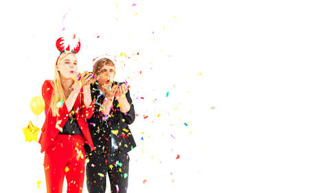 young people man and woman enjoy with colorful confetti in new year celebration hangout party and isolated on white backgroundの写真素材