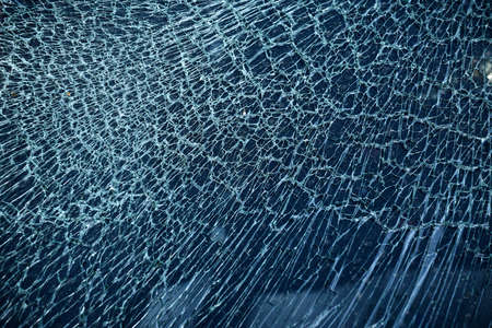 Cracked glass from car crash accidental with selective focusing, broken glass texture
