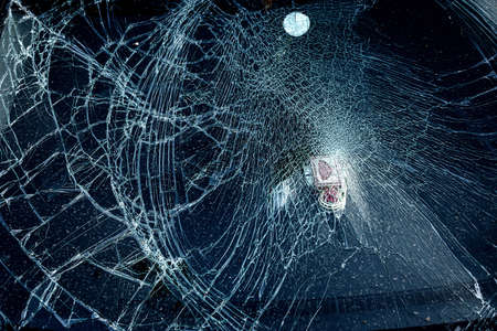 Cracked glass from car crash accidental with selective focusing, broken glass texture