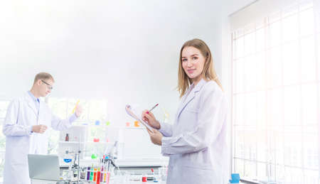 Scientists researching for some confidential in chemical laboratory, teamwork and scientist working...