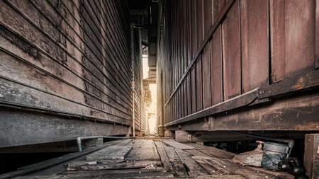 darkness dangerous walk alley in the city, crime and hazard background conceptの写真素材