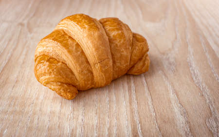 Close up of fresh delicious croissants on wooden background, Homemade croissants