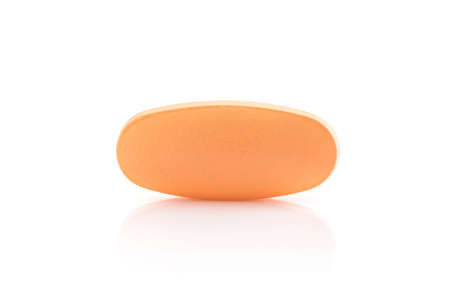 Vitamin C tablet for health in orange color isolated on white background with clipping pathの写真素材