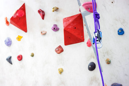Indoor rock climbing simulation wall for mountaineering or mountain climber training, sport activity conceptの写真素材