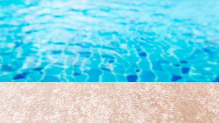 Side of swimming pool with water ripple texture background and copy space for product montage and displayの写真素材