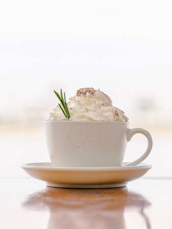Cup of Vienna Cappuccino coffee with fresh whipped cream on top for the relaxing time