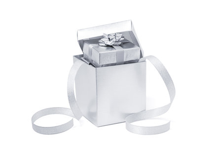Opened celebration silver gift or present boxes for celebrate party event decoration isolated on white backgroundの写真素材