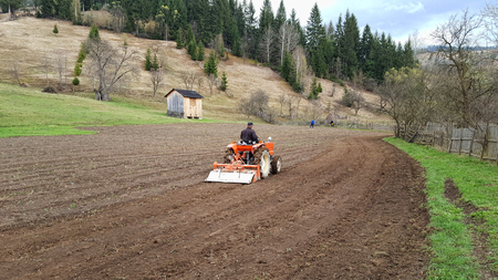 Tractor preparing land for sowingの写真素材