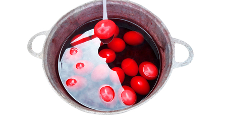 Red eggs in boiling waterの写真素材