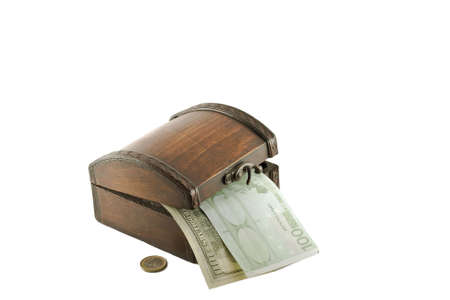 Money and an old chest, isolated on whiteの写真素材