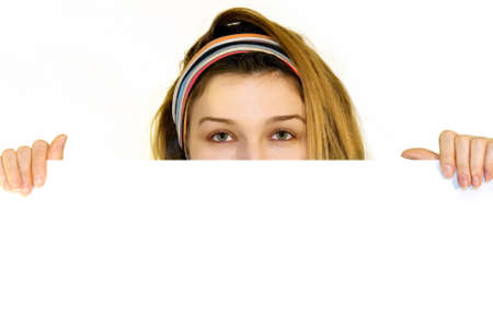 Pretty girl holding blank sign on white backgroundの写真素材
