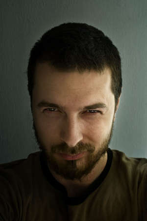 Portrait of ominous man with sparkling eyes